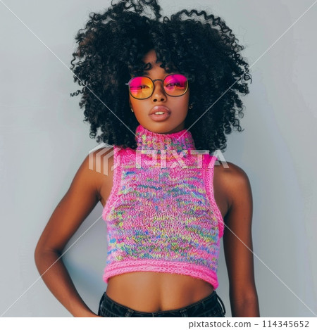 Stylish Young Woman Wearing Colorful Knit Sweater and Pink Sunglasses 114345652