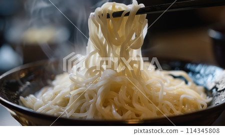 Japanese shirataki noodles in bowl with chopsticks Japanese shirataki noodles in bowl with chopsticks 114345808