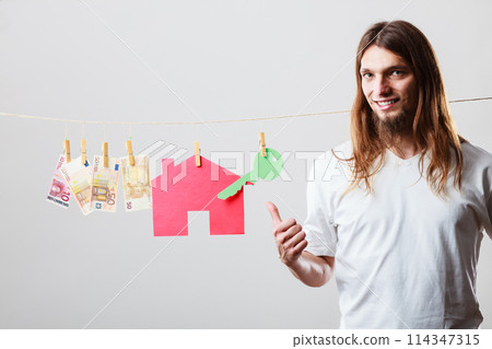 Man seller with money and house 114347315
