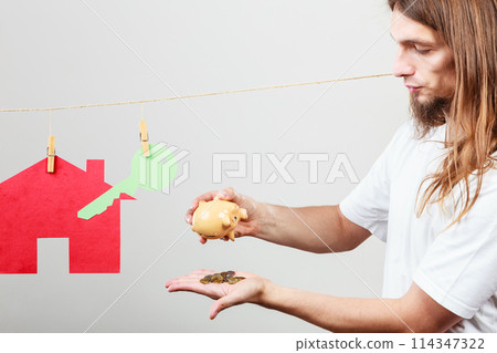 Man seller with money and house 114347322