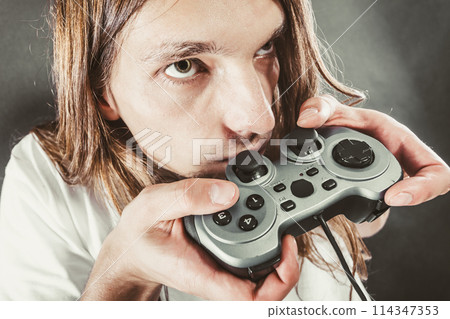 Male player focus on play games 114347353