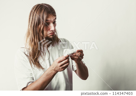 Man with hygienic tissue 114347403