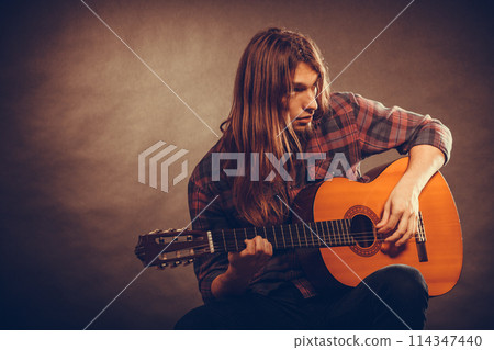 Musican and his instrument 114347440