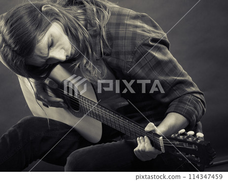 Black and white picture with guitarist. Black and white picture with guitarist. 114347459