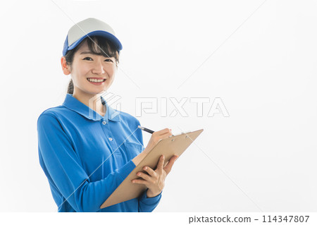 A woman in the delivery industry checking and filling out checklists, delivery slips, slips, and documents A woman in the delivery industry checking and filling out checklists, delivery slips, slips, and documents 114347807