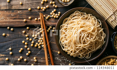 Soy noodles with soy beans and chopsticks on wooden table, top view 114348011