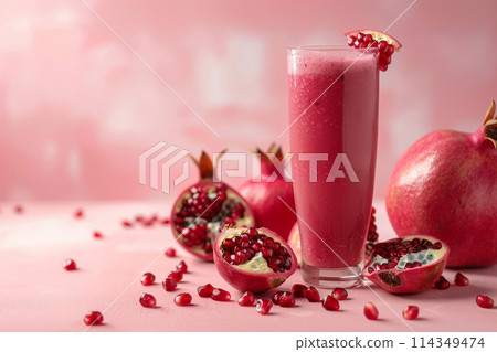 Fresh Pomegranate Smoothie on Pink Background Fresh Pomegranate Smoothie on Pink Background 114349474