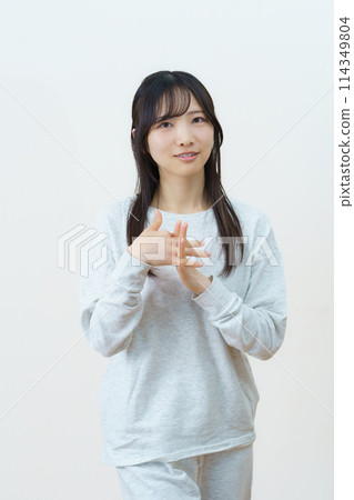 Young woman doing light exercise Young woman doing light exercise 114349804