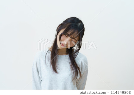 Young woman doing light exercise Young woman doing light exercise 114349808