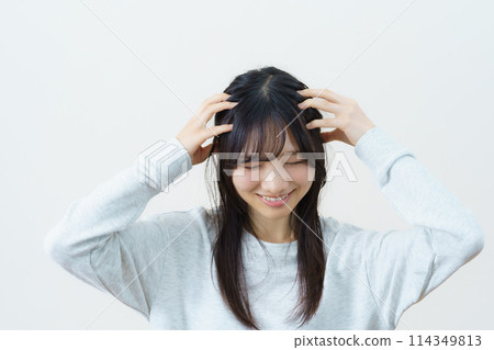 Young woman doing light exercise Young woman doing light exercise 114349813