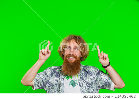 Young man showing thumbs up and pointing on blank space place over head for advertisement logo Young man showing thumbs up and pointing on blank space place over head for advertisement logo 114353468
