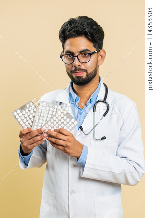 Indian doctor man show lot of tablet pills in blisters recommends drugs vitamin antibiotic treatment Indian doctor man show lot of tablet pills in blisters recommends drugs vitamin antibiotic treatment 114353503
