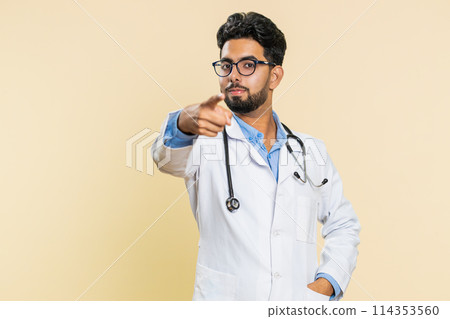 Smiling happy doctor man pointing forward to camera, choosing lucky winner, indicating, promotion Smiling happy doctor man pointing forward to camera, choosing lucky winner, indicating, promotion 114353560