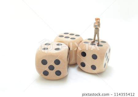 a young figure woman, company worker on dice a young figure woman, company worker on dice 114355412