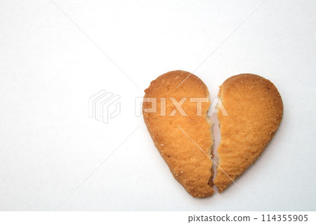 Cookie in the form of broken hearts - symbol of love Cookie in the form of broken hearts - symbol of love 114355905