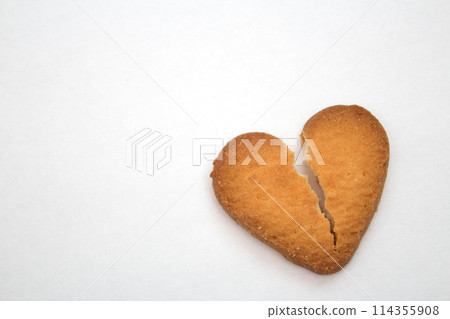 Cookie in the form of broken hearts - symbol of love Cookie in the form of broken hearts - symbol of love 114355908
