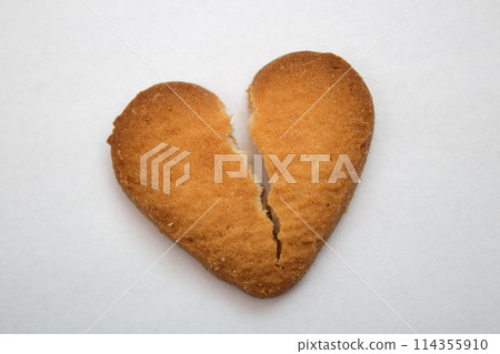 Cookie in the form of broken hearts - symbol of love Cookie in the form of broken hearts - symbol of love 114355910