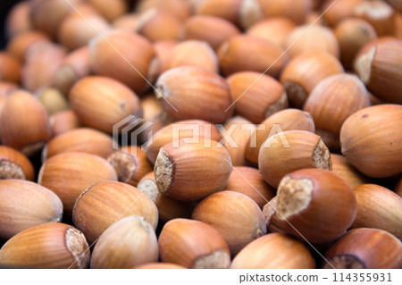 Many peeled hazel nuts - background of nature Many peeled hazel nuts - background of nature 114355931