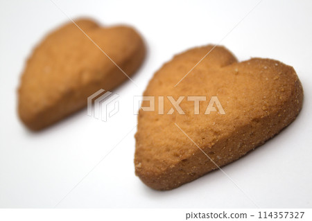 Two cookies in the form of hearts - symbol of love 114357327