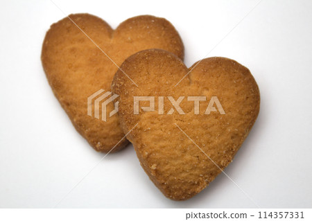 Two cookies in the form of hearts - symbol of love 114357331