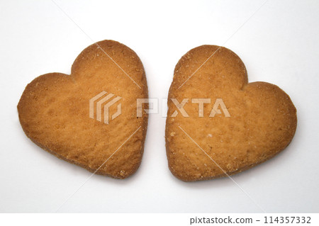Two cookies in the form of hearts - symbol of love Two cookies in the form of hearts - symbol of love 114357332