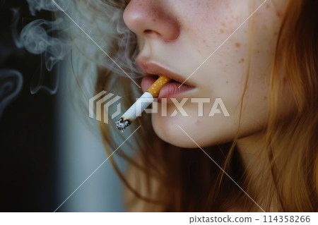 Close up young woman smoking cigarette 114358266