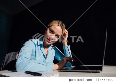 Business woman working on laptop in office finance online Business woman working on laptop in office finance online 114358500