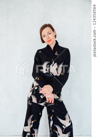 Portrait of a beautiful fashionable woman in a summer suit 114358564