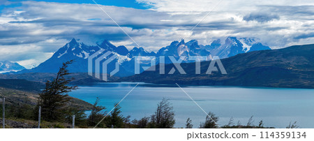 Majestic Mountain Range Overlooking a Serene Blue Lake 114359134