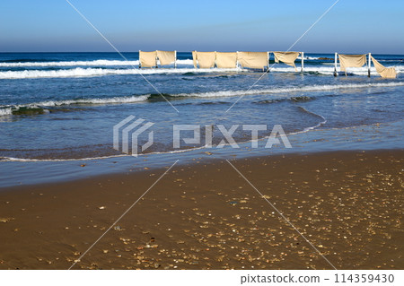 Sandy beach on the shores of the Mediterranean Sea in northern Israel. Sandy beach on the shores of the Mediterranean Sea in northern Israel. 114359430