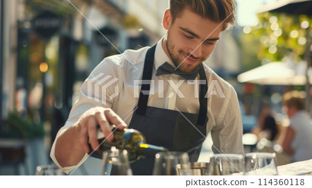 Chef in apron pouring wine into wine glass at event Chef in apron pouring wine into wine glass at event 114360118