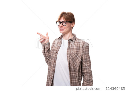 close-up portrait of a young dreaming caucasian man with red short hair pointing his finger to the close-up portrait of a young dreaming caucasian man with red short hair pointing his finger to the 114360485