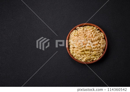 Delicious Asian dish rice noodles or udon with vegetables, spices and herbs Delicious Asian dish rice noodles or udon with vegetables, spices and herbs 114360542