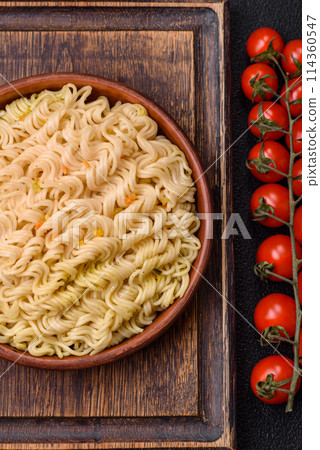 Delicious Asian dish rice noodles or udon with vegetables, spices and herbs 114360547
