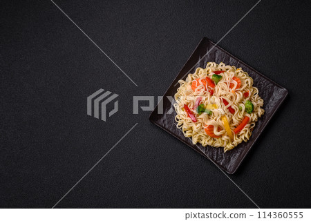 Delicious Asian dish rice noodles or udon with vegetables, spices and herbs 114360555