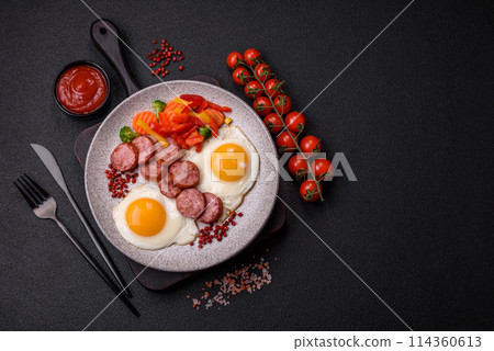 Delicious nutritious breakfast with fried eggs, sausage, steamed vegetables Delicious nutritious breakfast with fried eggs, sausage, steamed vegetables 114360613