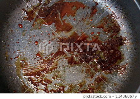 Close Up of Frying Pan With Food Cooking, dirty dishes, grease Close Up of Frying Pan With Food Cooking, dirty dishes, grease 114360679