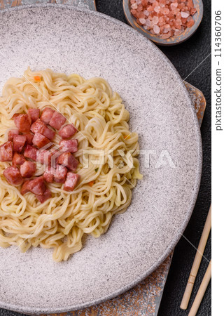 Delicious Asian dish rice noodles or udon with vegetables, spices and herbs Delicious Asian dish rice noodles or udon with vegetables, spices and herbs 114360706