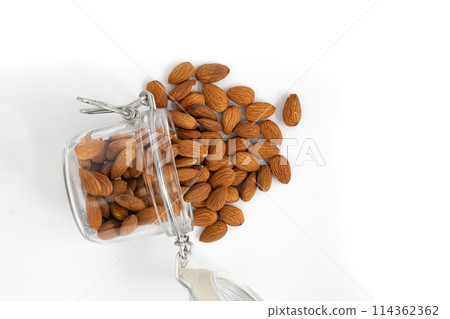 peeled almonds nuts isolated on white background, close up 114362362