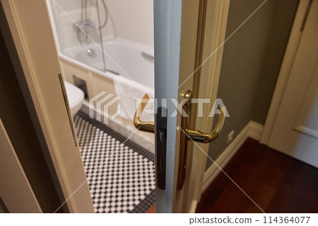 Bathroom toilet door open ajar 114364077
