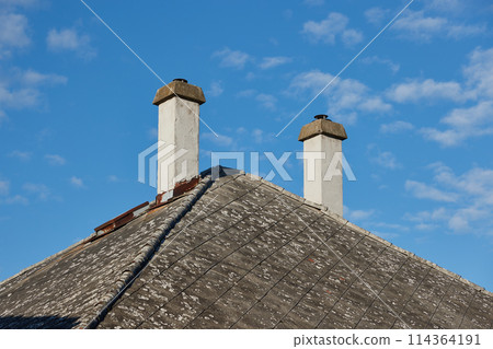 Chimneys on a house old roof Chimneys on a house old roof 114364191