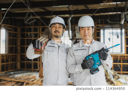 Workers working at a demolition site Workers working at a demolition site 114364950