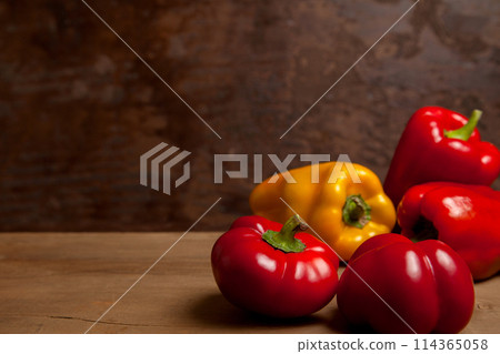 Assort of different shape and color bell pepper on wooden background.. 114365058