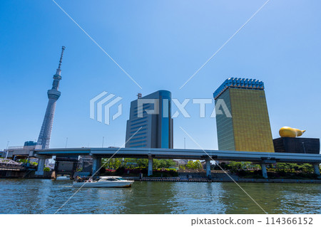 Cityscape of the Sumida River with clear blue sky and gentle flowing water | Japan | Tokyo Image 114366152