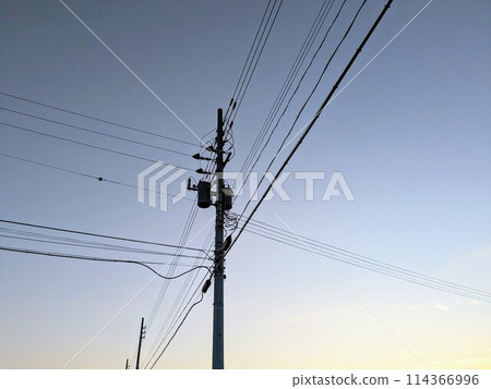 Twilight sky and utility poles Twilight sky and utility poles 114366996