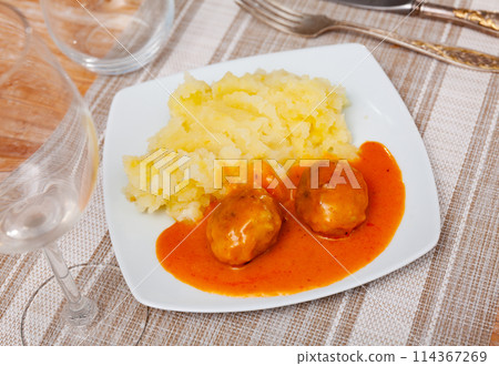 on square plate creamy mashed potatoes with round minced chicken meatballs with tomato sauce 114367269