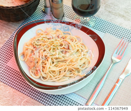 Spaghetti alla carbonara. Pasta with pancetta, parmesan cheese and cream sauce closeup Spaghetti alla carbonara. Pasta with pancetta, parmesan cheese and cream sauce closeup 114367949