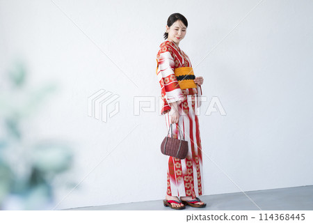 Full body of a cute woman in a red yukata on a white background Full body of a cute woman in a red yukata on a white background 114368445