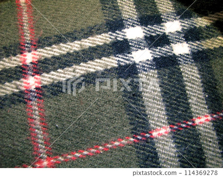 Close-up of a scarf with a check pattern. Close-up of a scarf with a check pattern. 114369278