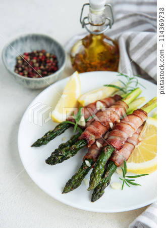 Asparagus baked with bacon Asparagus baked with bacon 114369738